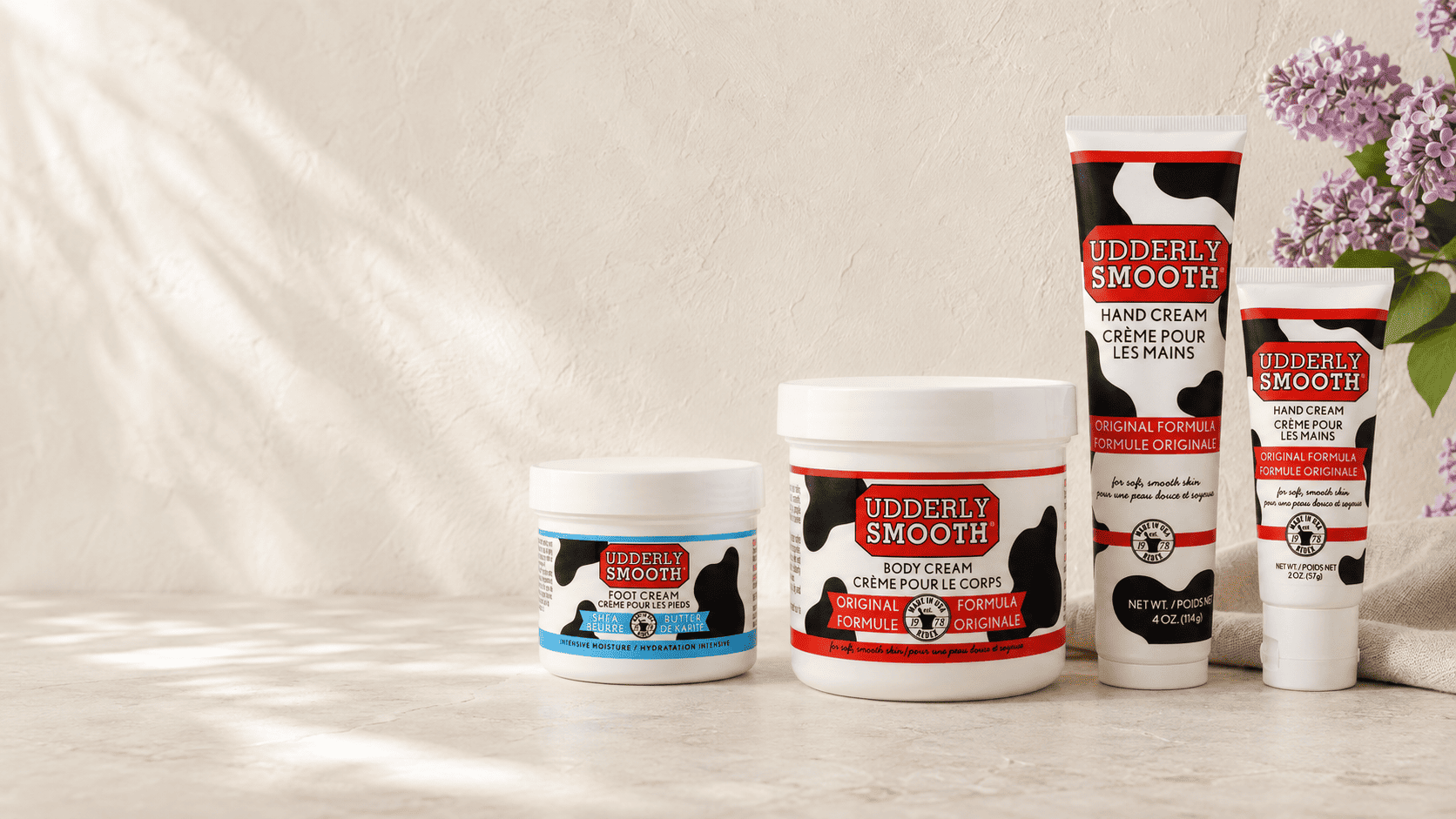 Udderly Smooth body cream, hand creams and shea butter foot cream with lilacs and sea glass.